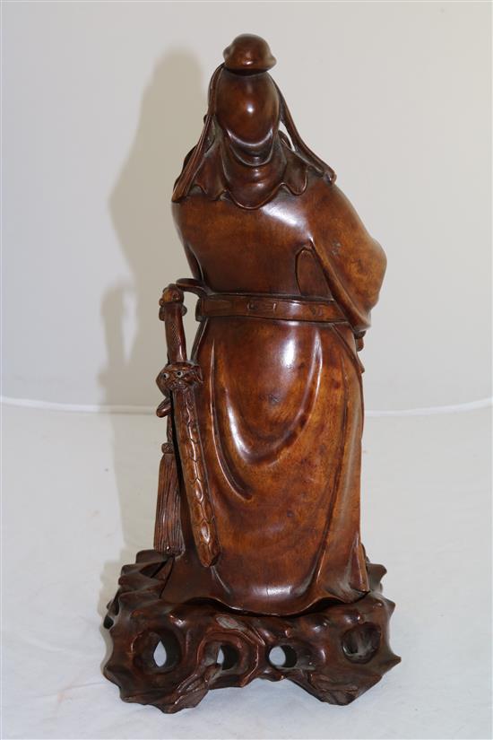 A Chinese rosewood figure of Lu Dongbin, early 20th century, total height 24cm